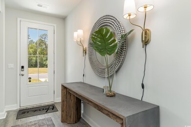 Doorway to outside featuring hardwood / wood-style