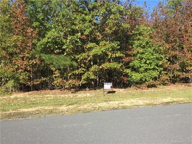 Beautifully wooded 1.69 Acre Lot 84