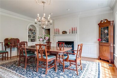 Formal dining room w/fireplace and arched shelves 