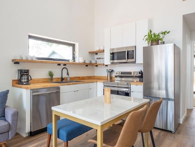 Kitchen featuring stainless steel appliances, a s