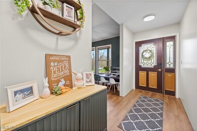 Entrance foyer with light wood finished floors