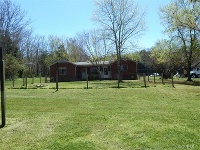 View of rear of home with fenced area in back yard