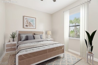 Bedroom featuring baseboards and a ceiling fan