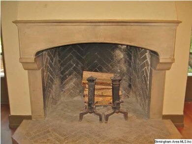 Stone and brick masonry fireplace. Original andiro