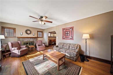 Living room 21 x 12 with brick gas fireplace, hard