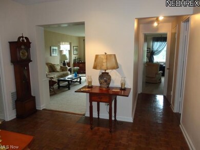 Lovely foyer with parquet floor.