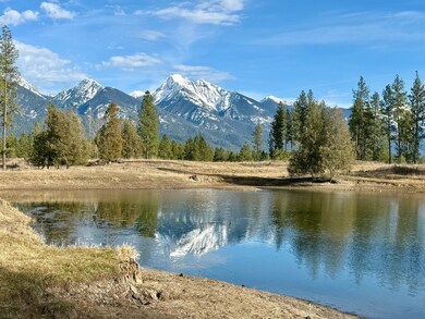 Huge pond with towering mountain views