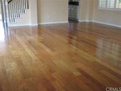 Family/dinning area with beautiful wood flooring a