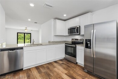 Kitchen with appliances with stainless steel finis