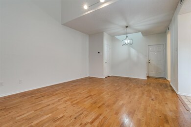 Spare room featuring a notable chandelier and ligh
