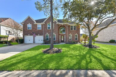 This two-story traditional red brick home offers over 4200 square feet of well-appointed living space plus a lush yard, mature trees, and a private pool!