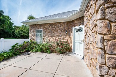 15X10 concrete, partially fenced patio area with v