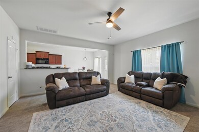 Living room featuring a wealth of natural light, c