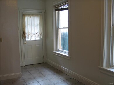 alternate view of kitchen with door leading to bac