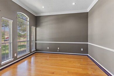 Study has French doors, hardwood floors, chair rai