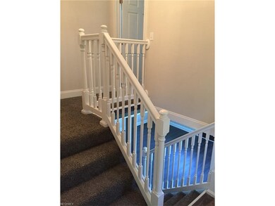 Stairwell leading up to master suite and down to family room, garage, laundry, and basement.