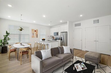 Living room featuring sink and light hardwood / wo