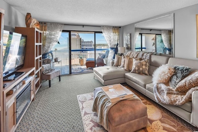 Living room with a view of city, a textured ceilin