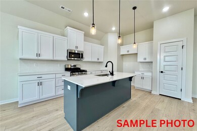 The quartz countertops, walk-in pantry, and stainless steel appliances provide the perfect combination of style and functionality for a modern and efficient living experience.
