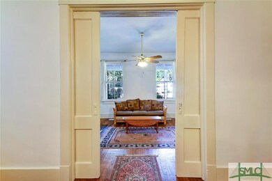 The original pocket door can close off the front p