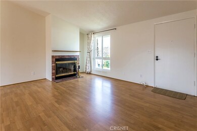 Wood burning fireplace in living room. Dual pane window through out