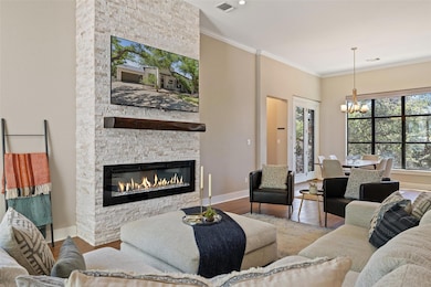 Living room featuring a chandelier, wood finished