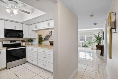 This home has an open floor plan that allows you to chat with guests in the dining area while you cook in the kitchen.