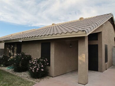 Back of home with covered patio