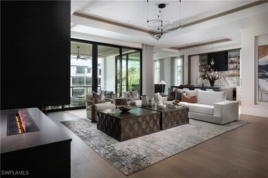 Living room featuring a raised ceiling, plenty of