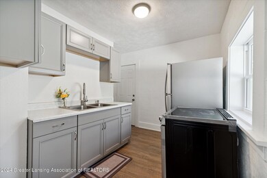 05-1030-May-St-Lansing-MI-48906-WindowSt