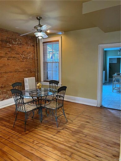 Dining Area with exposed brick
