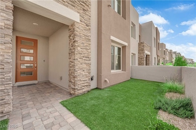 Doorway to property with stone siding, stucco sidi