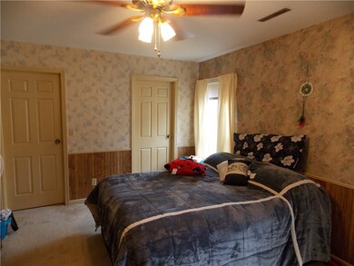 Master bedroom with two walk-in closets.
