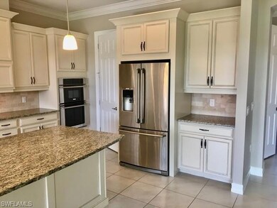 Kitchen with appliances with stainless steel finis