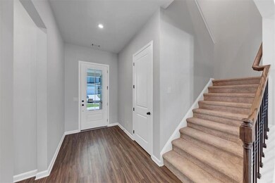 Entrance foyer featuring dark wood finished floors