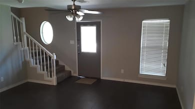 Foyer entrance with ceiling fan