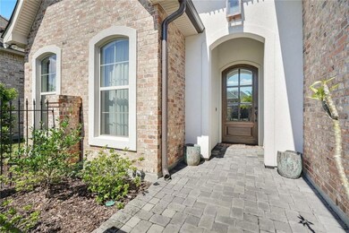 Enter this beautiful home through its front courty