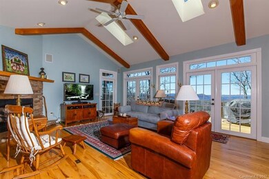 Great Room with wall of windows and doors bringing