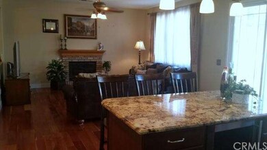 Family Room w/cozy fireplace is open to the Kitche