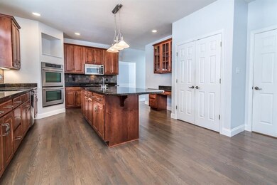 Cook up a storm in this cherry kitchen with granit