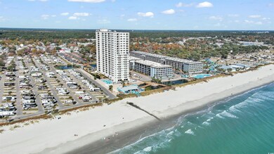 Aerial view of waterfront with a beach