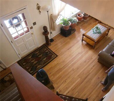 LOOKING DOWN INTO THE LIVINGROOM FROM THE 2 STORY 