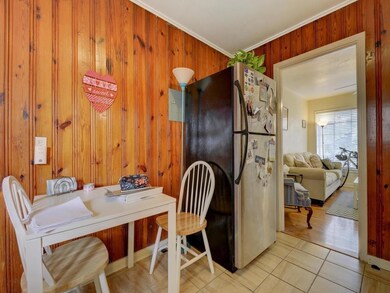 Dining area featuring wooden walls, ornamental mo