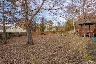 View of yard with a wooden deck