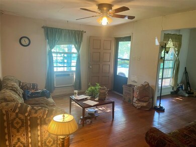 Living room with hardwood / wood-style flooring, c