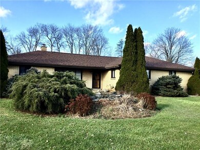 Front of home with Koi Pond