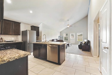 Spacious open-concept kitchen and living room feat