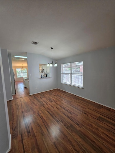 Unfurnished dining area featuring a chandelier, d