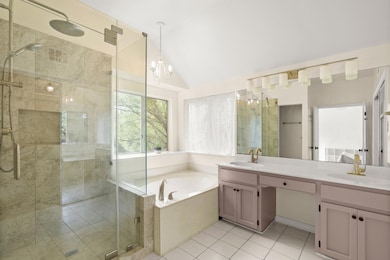 Full bathroom with a stall shower, a garden tub, 