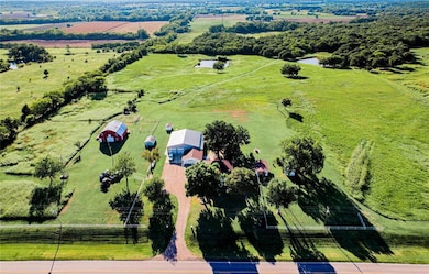Birds eye view of property with a rural view